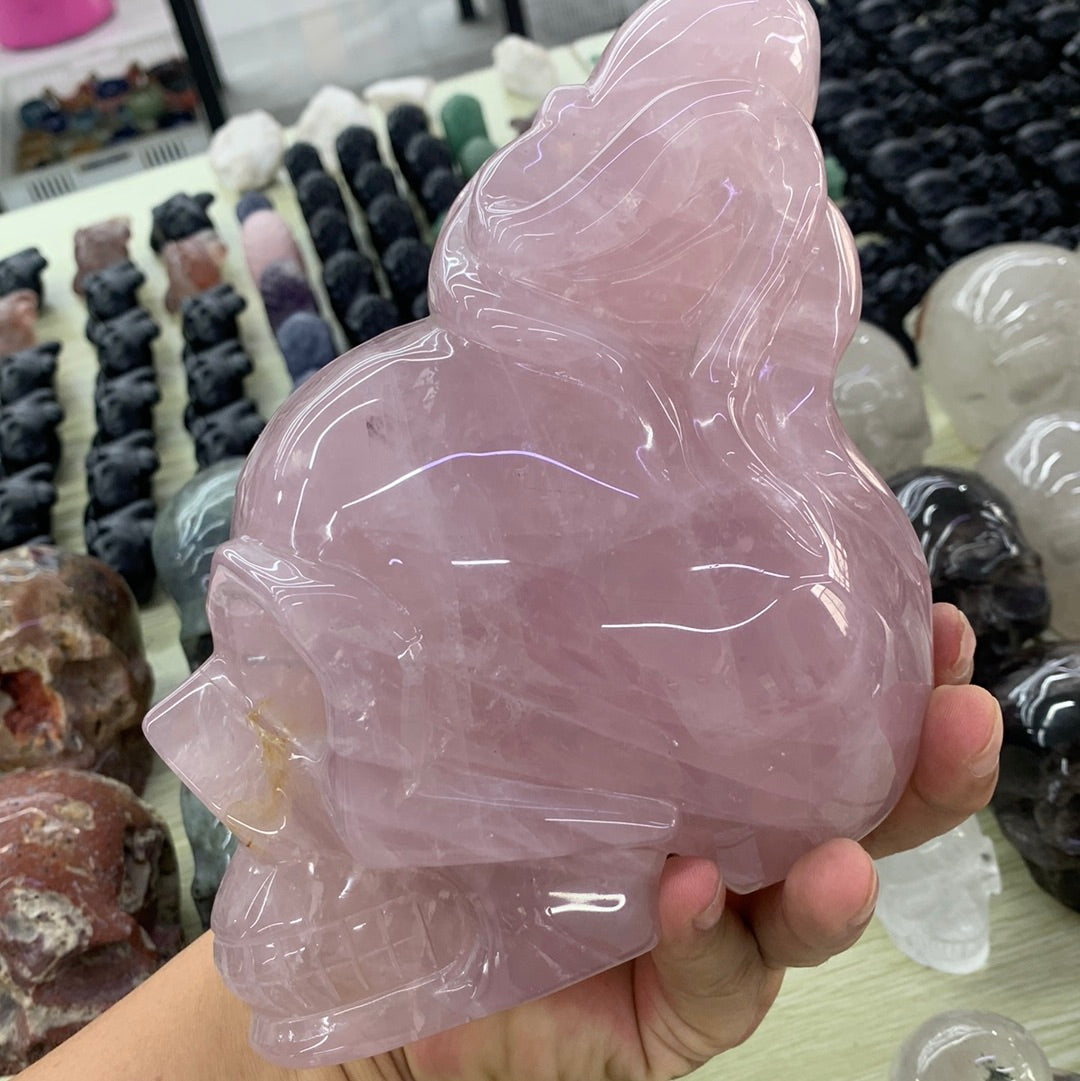 Rose quartz skull with octopus carvings