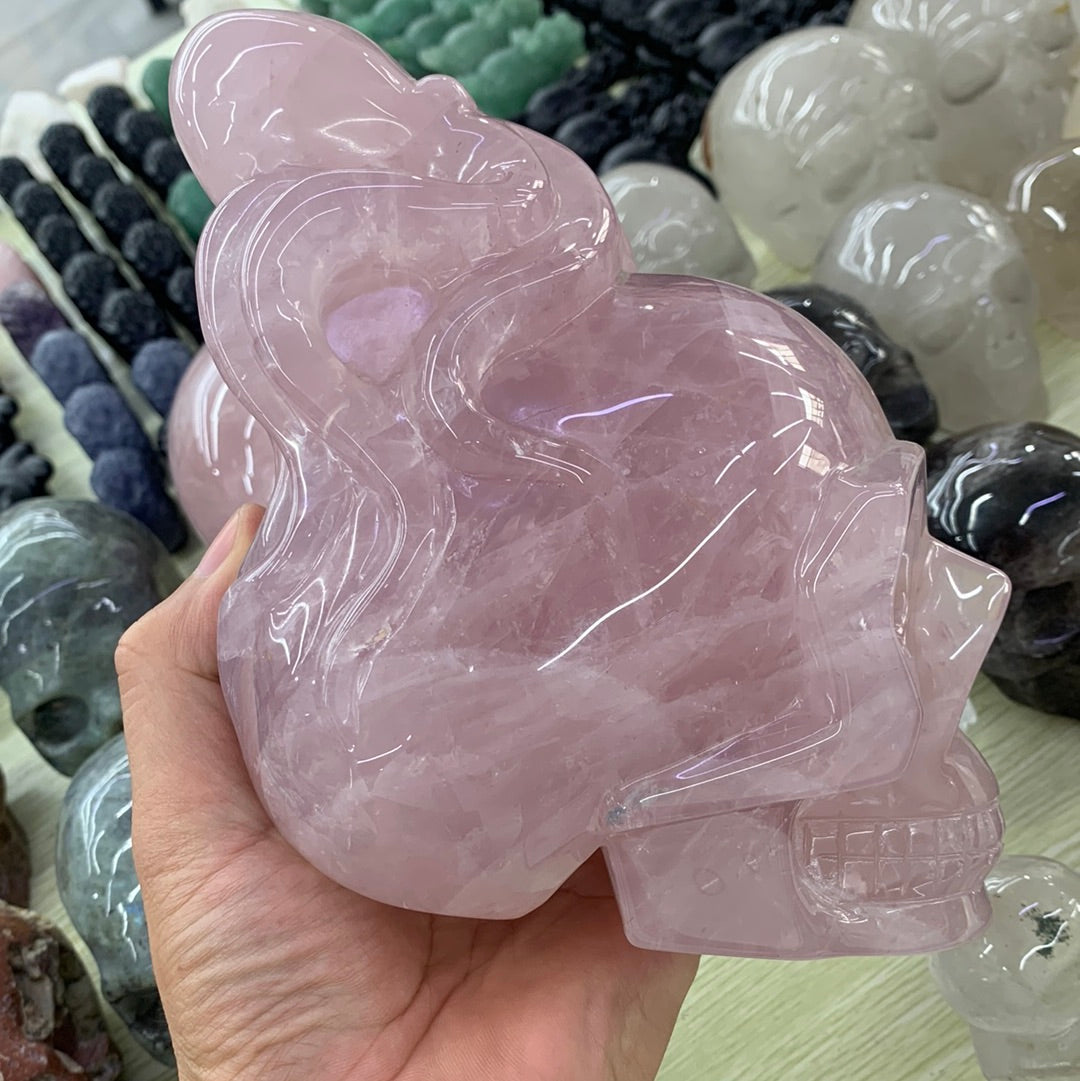 Rose quartz skull with octopus carvings