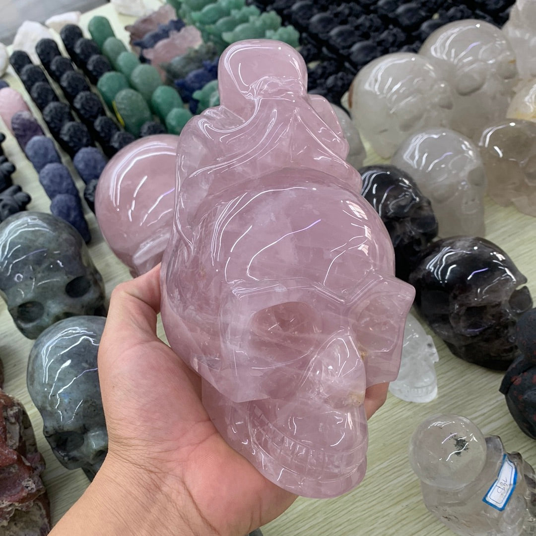 Rose quartz skull with octopus carvings