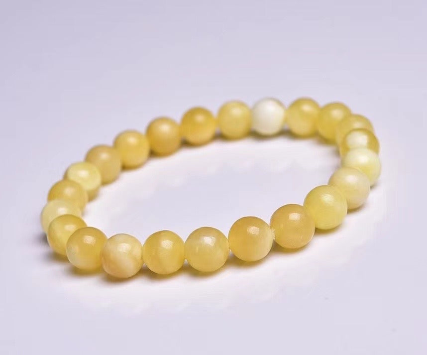 Orange calcite round bead bracelets