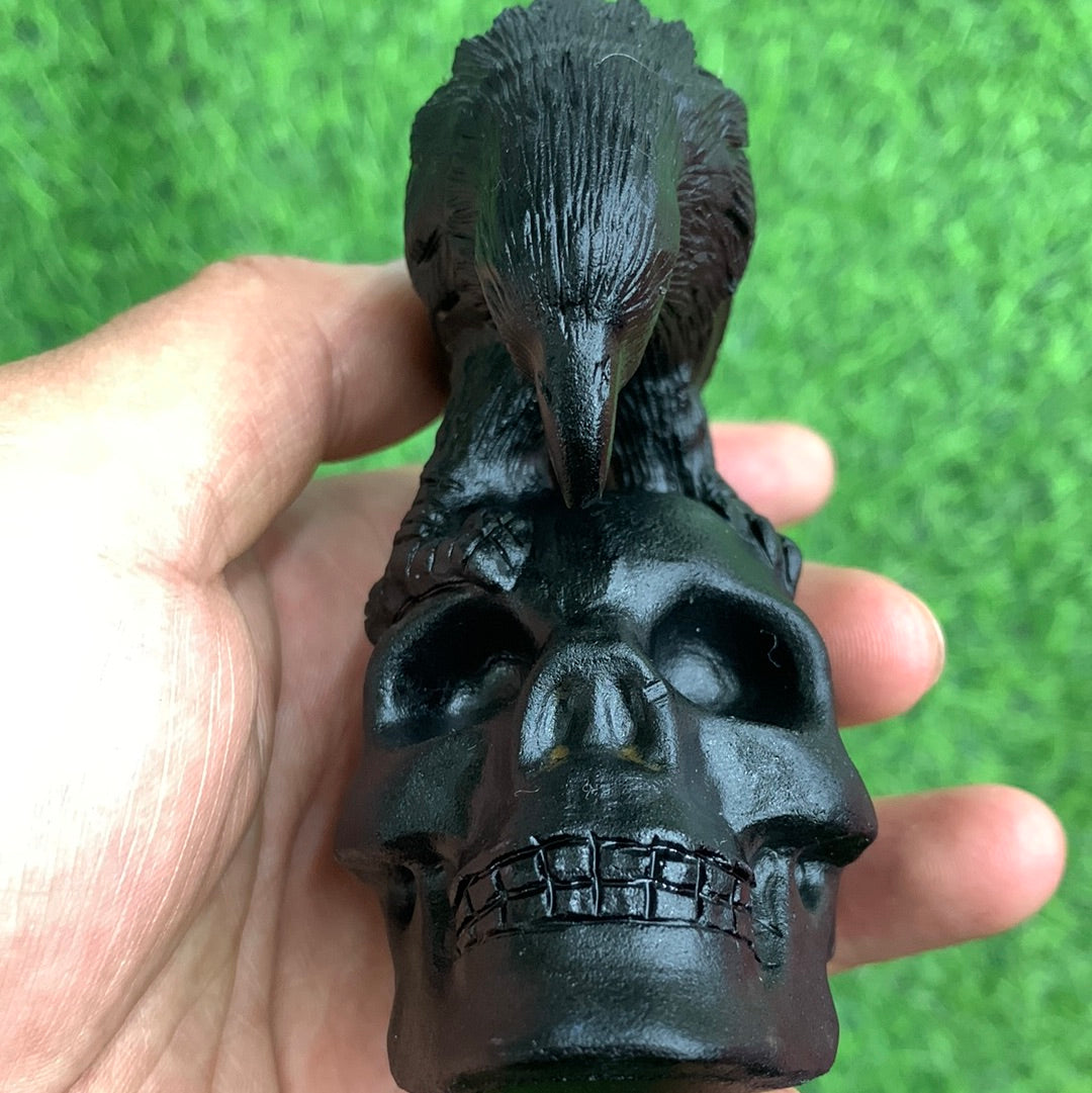 Crow and skull carvings